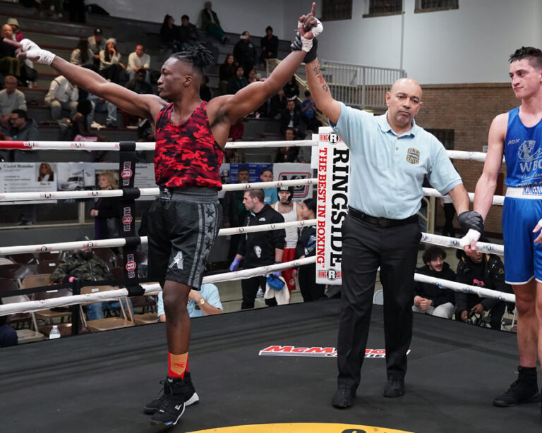 Zachary Carter has his arms raised in victory after his semi-final win at the Chicago Golden Gloves