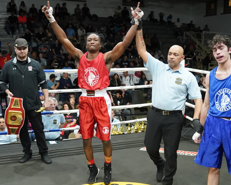 Zachary Carter's hands raised in victory at the finals of the Chicago Golden Gloves Tournament